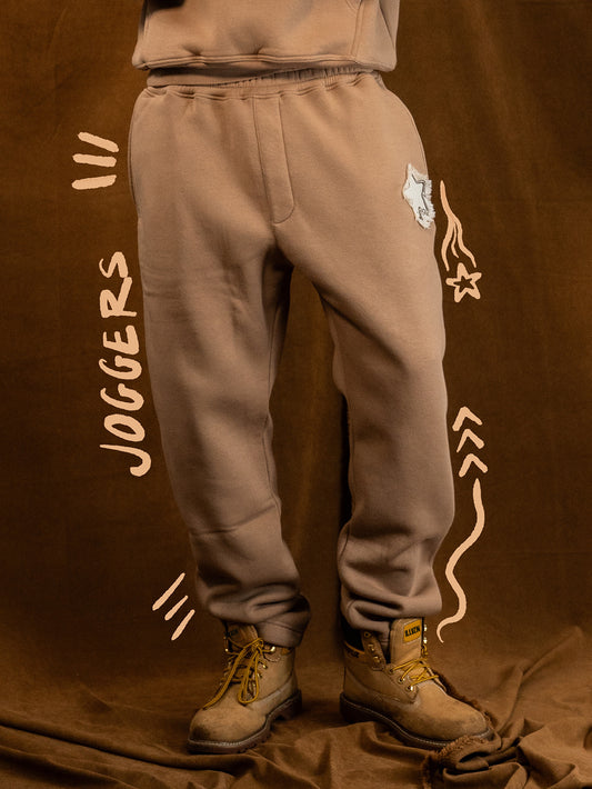 DISTRESSED APPLIQUE JOGGERS - PEANUT